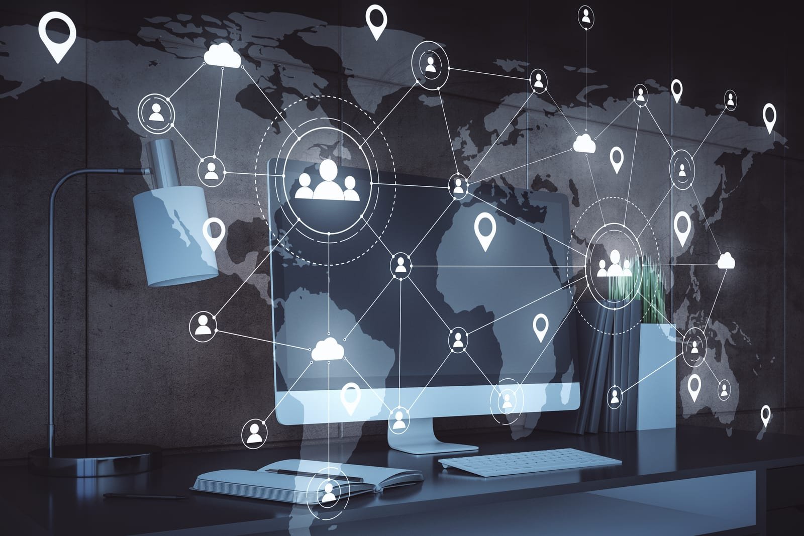 A monitor on a desk against a world-map wall, overlaid with a glowing network of connected nodes, people, and location pins across the continents